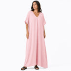 Women's long, flowy, oversized V-neck dress – chic and comfortable for summer.