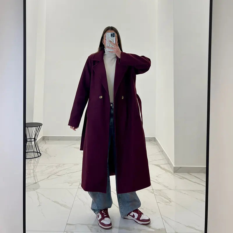 Coat with a belt at the waist