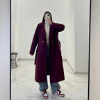 Coat with a belt at the waist