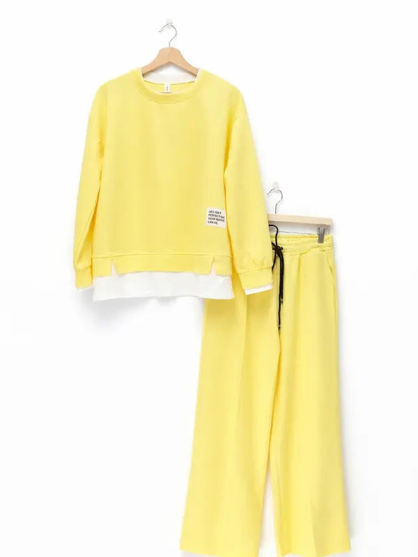 Women's tracksuit: hoodie and sweatpants, casual wear, simple straight-leg style.