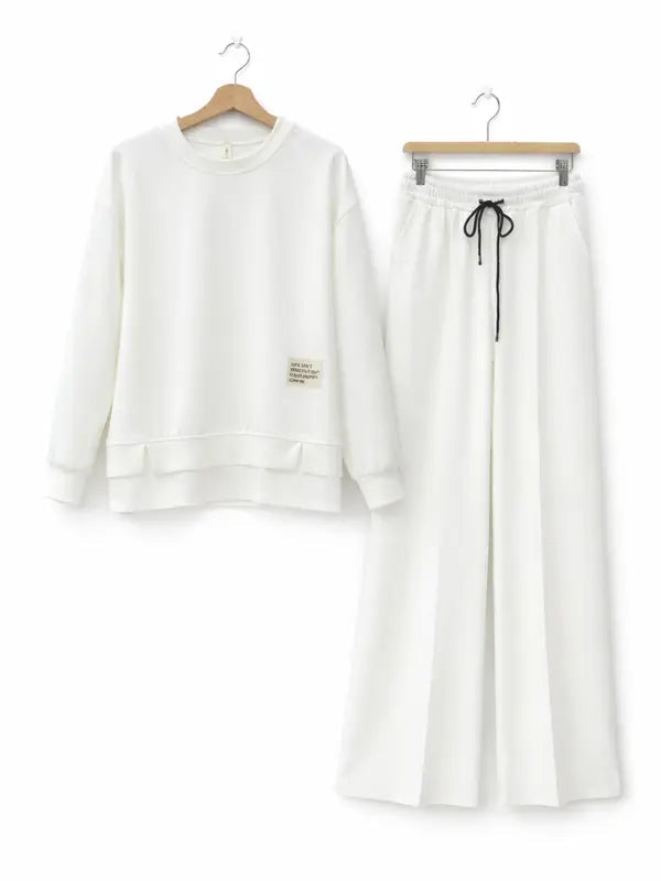 Women's tracksuit: hoodie and sweatpants, casual wear, simple straight-leg style.