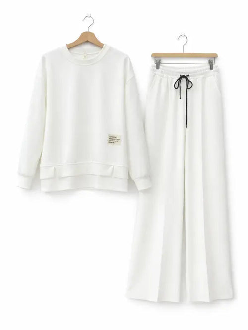 Women's tracksuit: hoodie and sweatpants, casual wear, simple straight-leg style.