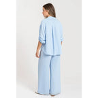 Two-piece set: loose-fitting shirt-style top, loose-fitting trousers, elastic waistband.