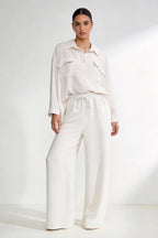 Two-piece set: loose-fitting shirt-style top, loose-fitting trousers, elastic waistband.