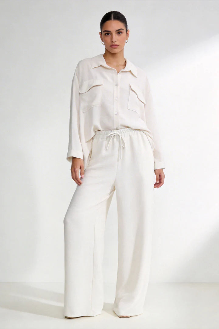 Two-piece set: loose-fitting shirt-style top, loose-fitting trousers, elastic waistband.