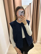Soft, sleeveless vest for a chic and comfortable look.
