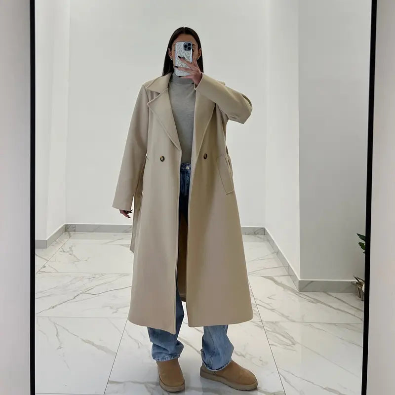 Coat with a belt at the waist