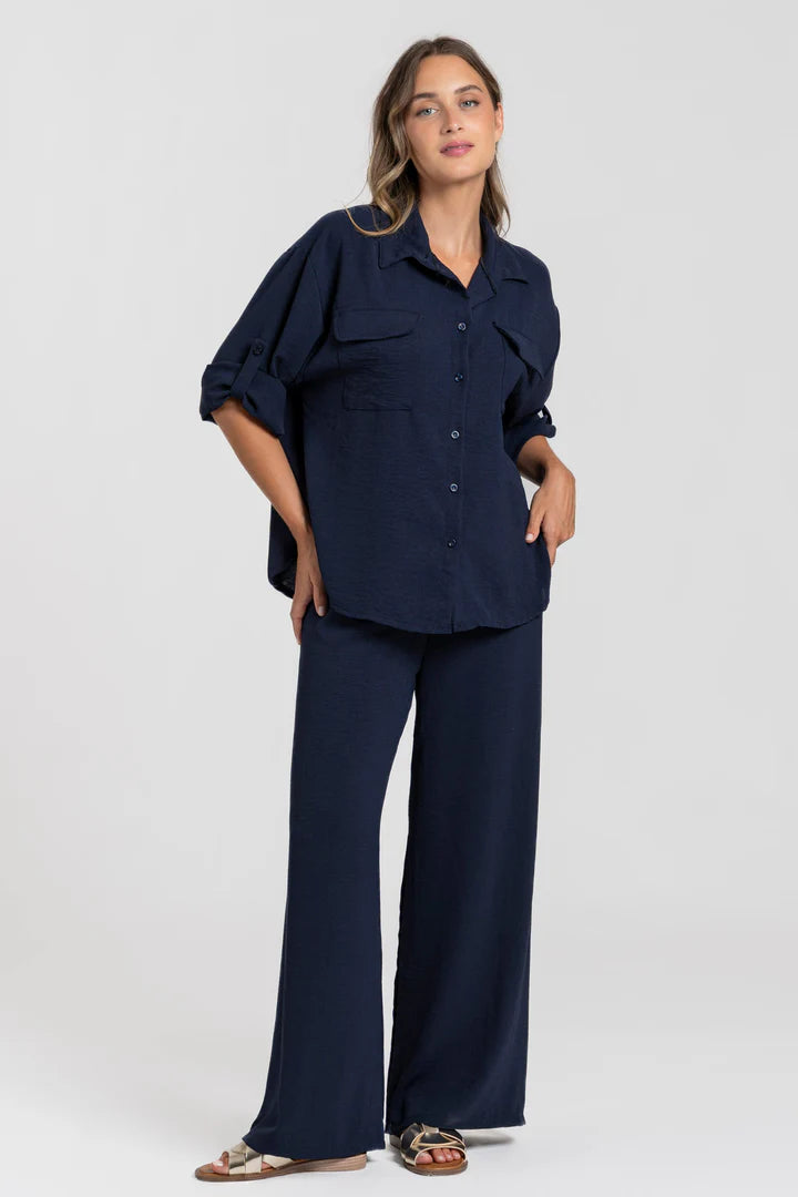 Two-piece set: loose-fitting shirt-style top, loose-fitting trousers, elastic waistband.