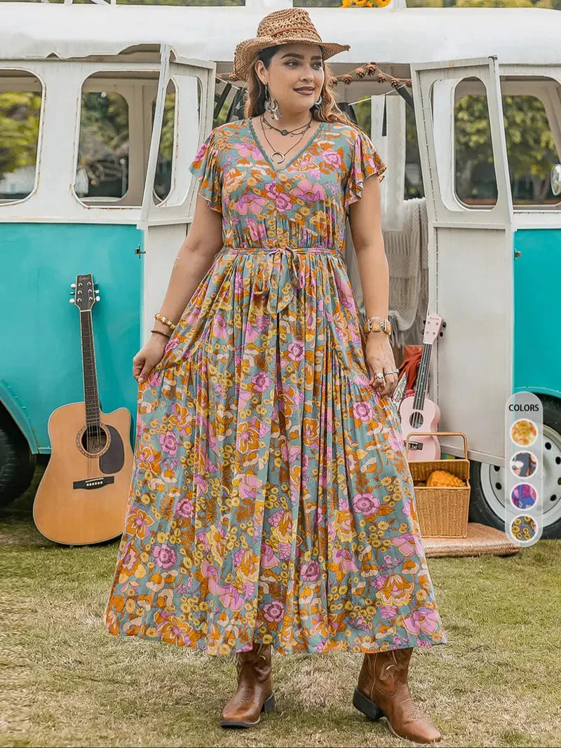 A-line dress with butterfly sleeves, belt, ruffled hem, and floral print