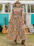 A-line dress with butterfly sleeves, belt, ruffled hem, and floral print