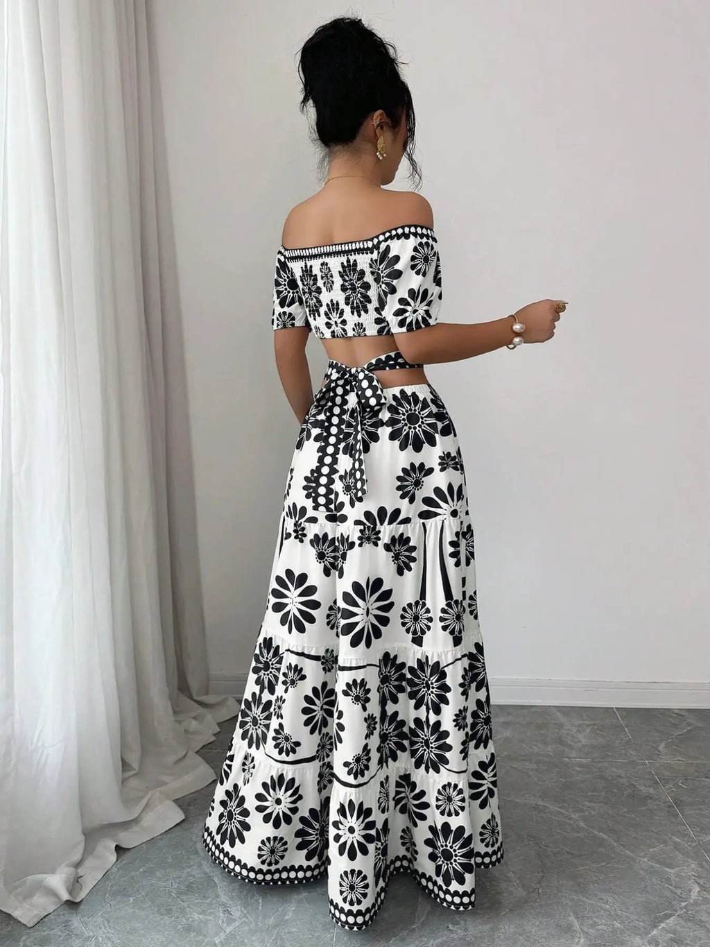 Women's off-the-shoulder short-sleeve floral dress with waist cutouts