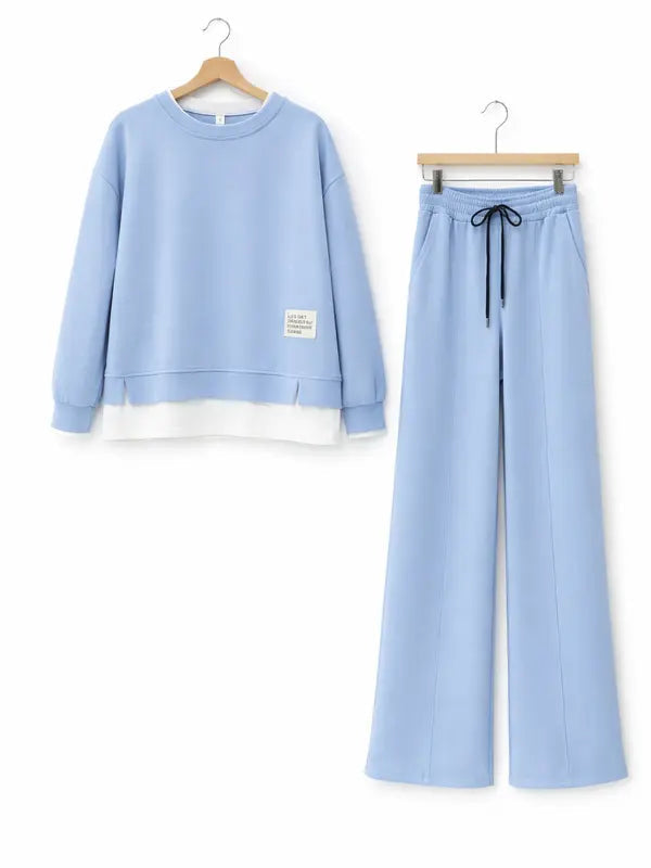 Women's tracksuit: hoodie and sweatpants, casual wear, simple straight-leg style.