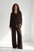 Two-piece set: loose-fitting shirt-style top, loose-fitting trousers, elastic waistband.
