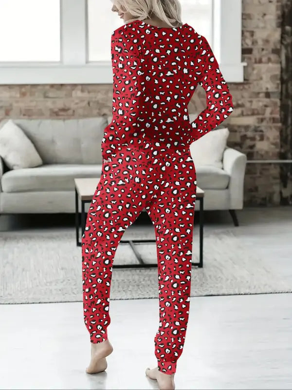 Women's V-NeckLeopard Print Loungewear Set. This relaxed-fit two-piece features a short-sleeve top and pants for effortlessly chic, casual comfort.