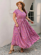 A-line dress with butterfly sleeves, belt, ruffled hem, and floral print
