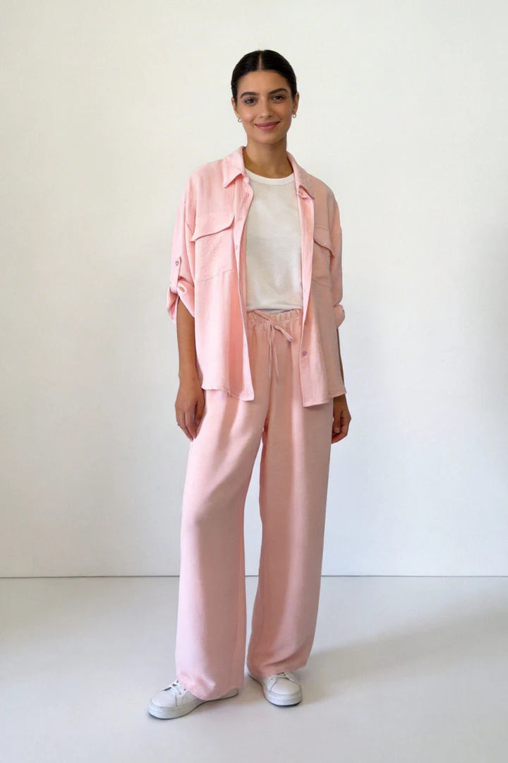 Two-piece set: loose-fitting shirt-style top, loose-fitting trousers, elastic waistband.