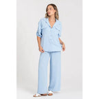 Two-piece set: loose-fitting shirt-style top, loose-fitting trousers, elastic waistband.