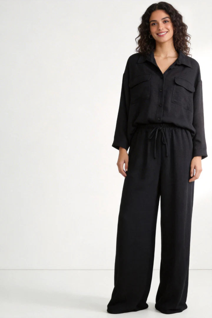 Two-piece set: loose-fitting shirt-style top, loose-fitting trousers, elastic waistband.