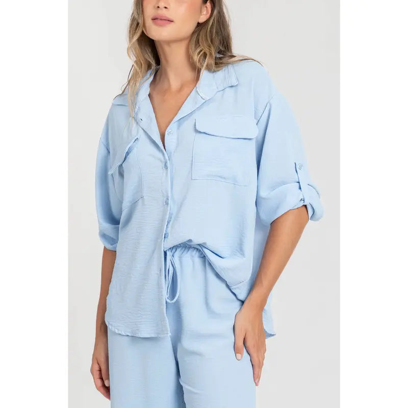 Two-piece set: loose-fitting shirt-style top, loose-fitting trousers, elastic waistband.