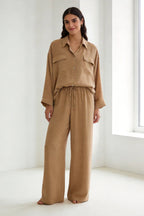 Two-piece set: loose-fitting shirt-style top, loose-fitting trousers, elastic waistband.