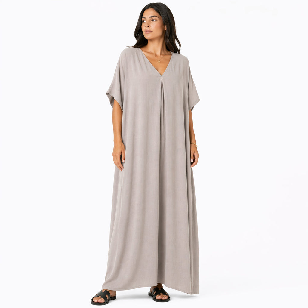 Women's long, flowy, oversized V-neck dress – chic and comfortable for summer.