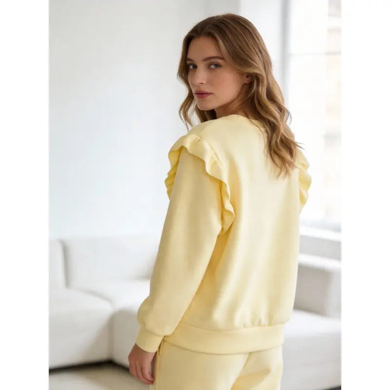 Women's tracksuit with ruffled top and trousers