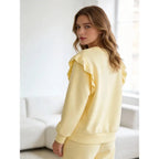 Women's tracksuit with ruffled top and trousers