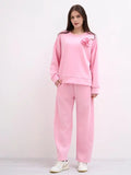 This two-piece wetsuit set, made of wetsuit viscose fabric, includes a shirt adorned with a flower brooch and a pair of elasticated harem pants.