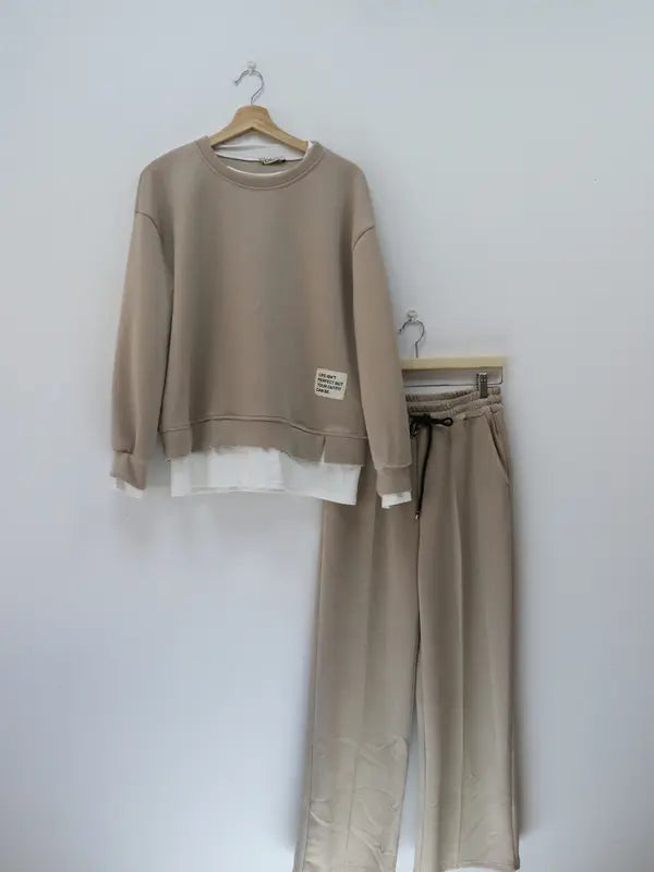 Women's tracksuit: hoodie and sweatpants, casual wear, simple straight-leg style.