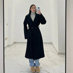Coat with a belt at the waist
