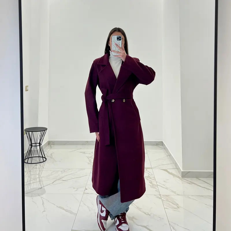 Coat with a belt at the waist