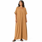 Women's long, flowy, oversized V-neck dress – chic and comfortable for summer.
