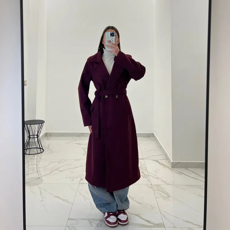 Coat with a belt at the waist