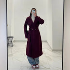 Coat with a belt at the waist