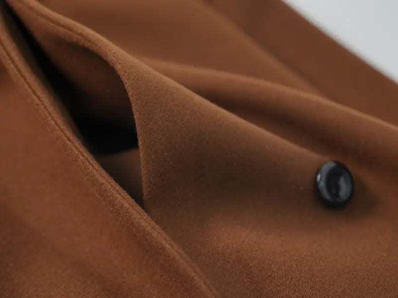 Long double-breasted coat with a belt and lapel, suitable for everyday wear and versatile