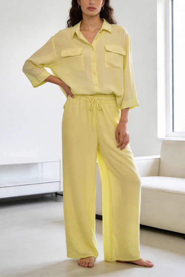 Two-piece set: loose-fitting shirt-style top, loose-fitting trousers, elastic waistband.