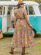 A-line dress with butterfly sleeves, belt, ruffled hem, and floral print