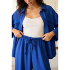 Two-piece set: loose-fitting shirt-style top, loose-fitting trousers, elastic waistband.