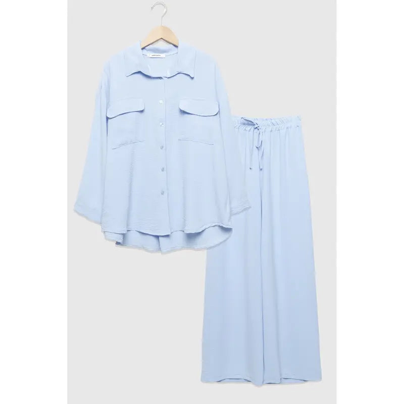 Two-piece set: loose-fitting shirt-style top, loose-fitting trousers, elastic waistband.