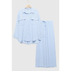 Two-piece set: loose-fitting shirt-style top, loose-fitting trousers, elastic waistband.