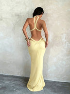 Vacation dress featuring a shimmering ribbon and cut-outs