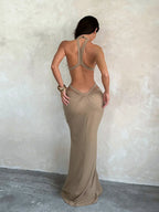 Vacation dress featuring a shimmering ribbon and cut-outs