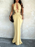 Vacation dress featuring a shimmering ribbon and cut-outs