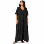 Women's long, flowy, oversized V-neck dress – chic and comfortable for summer.