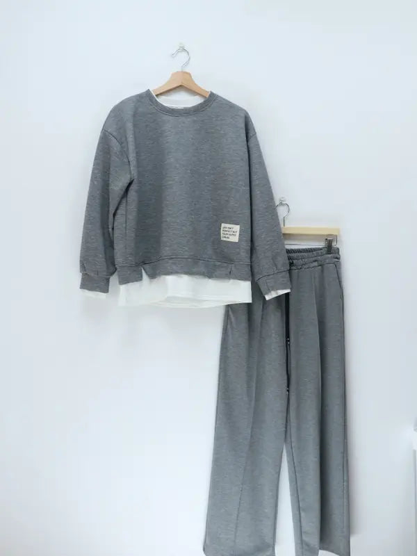 Women's tracksuit: hoodie and sweatpants, casual wear, simple straight-leg style.
