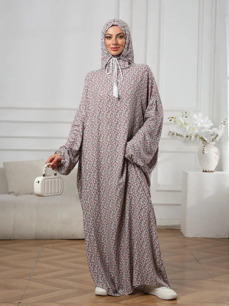 Plus-Size Fashion Floral Dress with Hood and Drawstring — featuring a loose fit, long lantern sleeves, and a modest yet casual style.