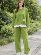 Women's tracksuit: hoodie and sweatpants, casual wear, simple straight-leg style.
