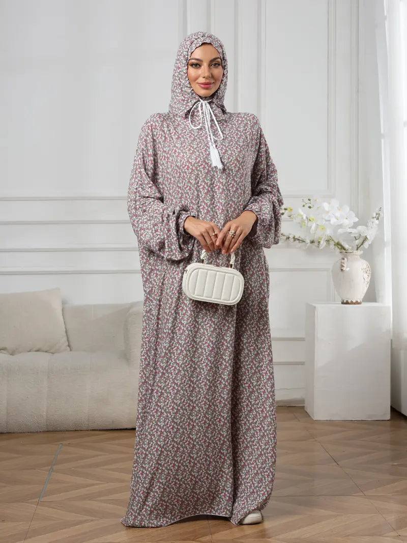 Plus-Size Fashion Floral Dress with Hood and Drawstring — featuring a loose fit, long lantern sleeves, and a modest yet casual style.