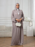 Plus-Size Fashion Floral Dress with Hood and Drawstring — featuring a loose fit, long lantern sleeves, and a modest yet casual style.