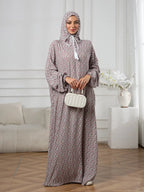 Plus-Size Fashion Floral Dress with Hood and Drawstring — featuring a loose fit, long lantern sleeves, and a modest yet casual style.